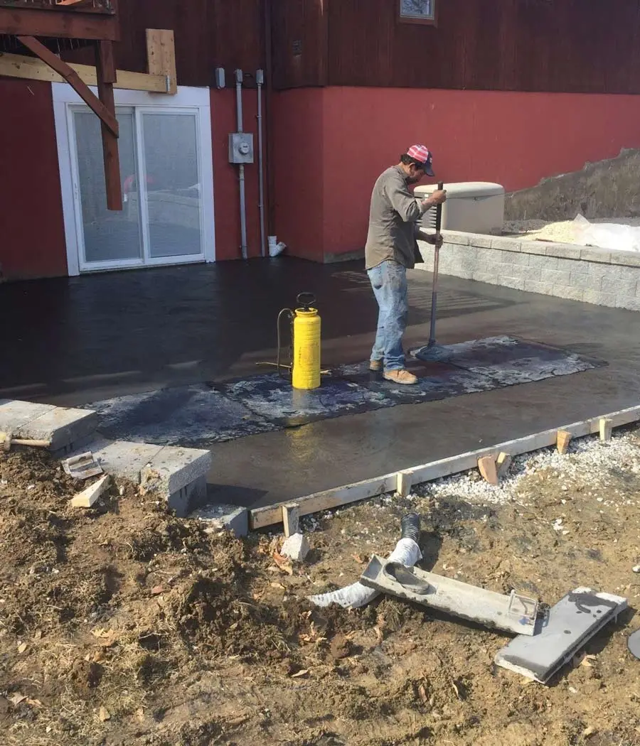 Stamped concrete installation in Shawnee, KS — professional crew on site | Ford Concrete