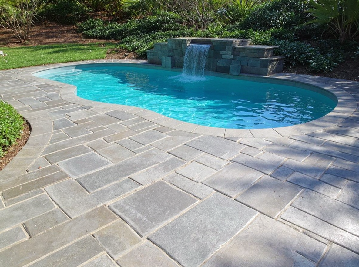 Decorative slate texture concrete pool deck silver grey — Ford Concrete design idea
