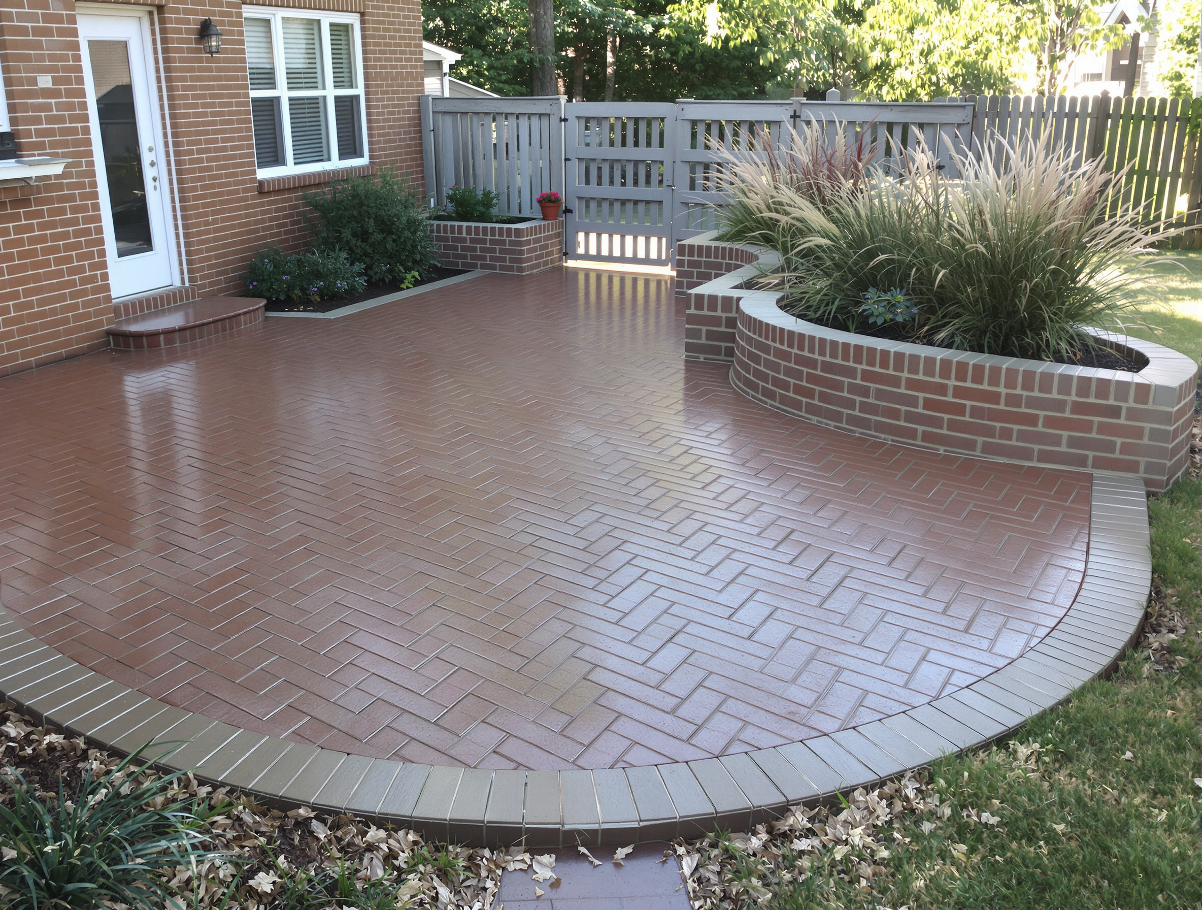 Stamped concrete patio brick wraparound — Ford Concrete design idea