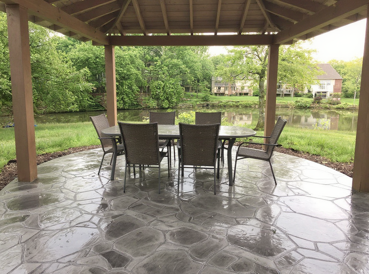 Stamped concrete patio flagstone outdoor dining — Ford Concrete design idea