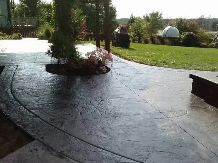Decorative stamped concrete patio Kansas City — charcoal stone pattern | Ford Concrete