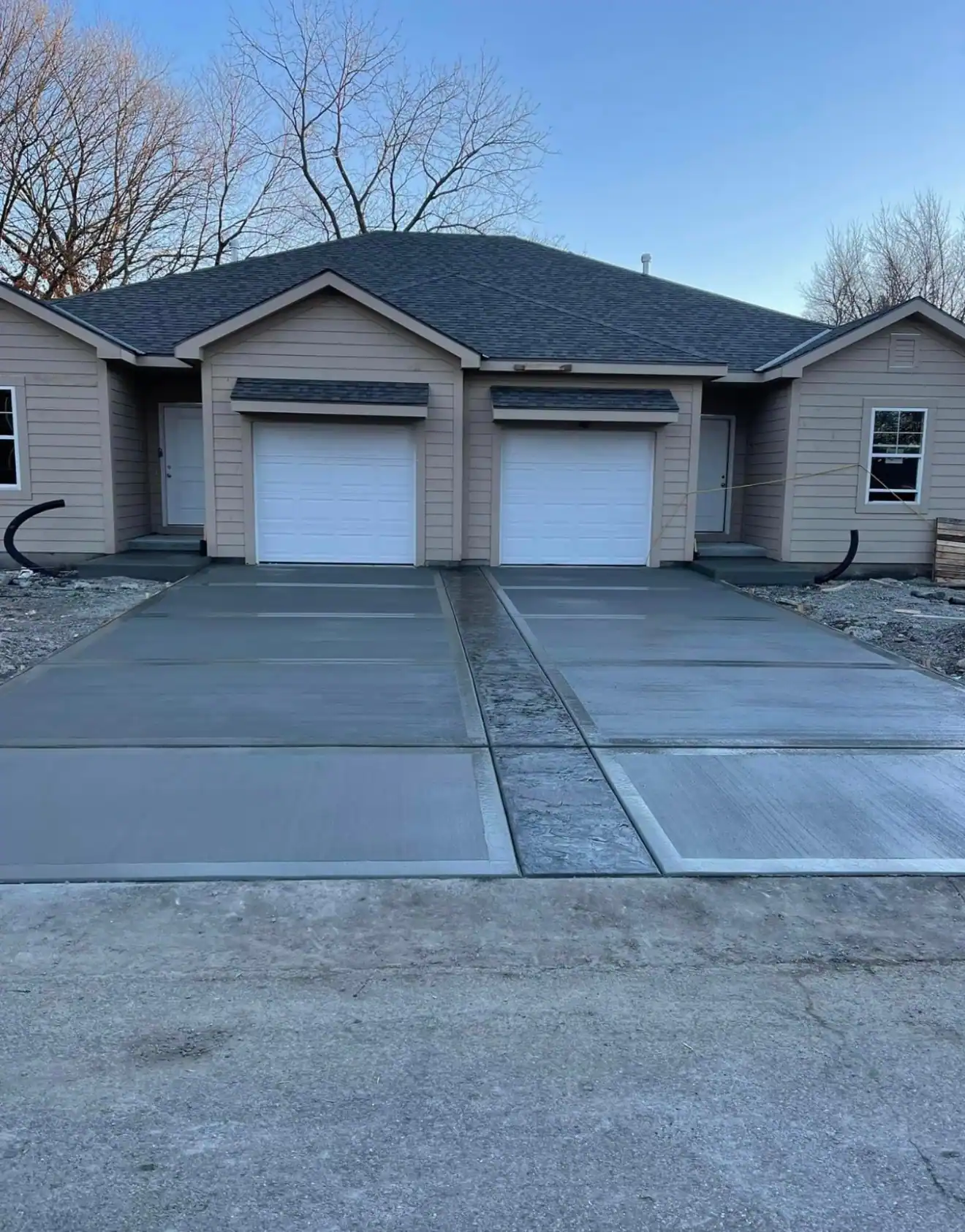 New concrete driveway installation Kansas City — duplex new construction | Ford Concrete
